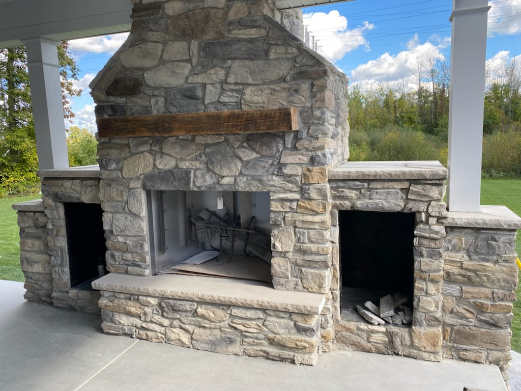 Outdoor masonry stone fireplace